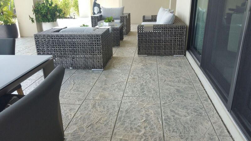 modern large tile pattern stamped concrete patio