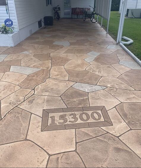 custom driveway resurfacing in natural color stone pattern
