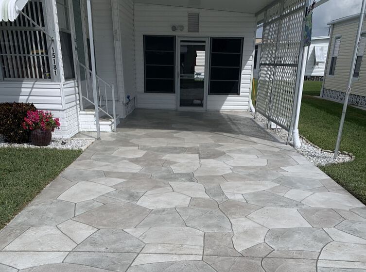 Stamped concrete driveway design in three different stone colors