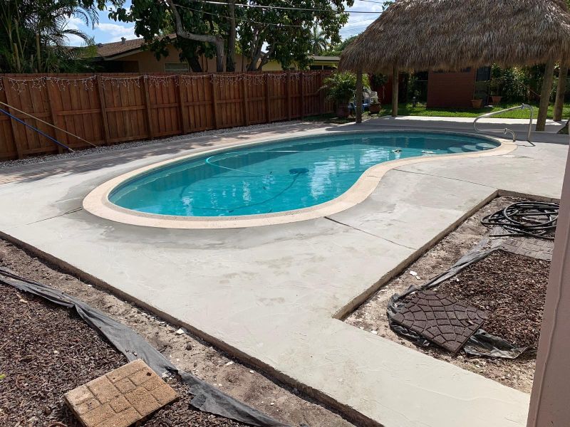 before complete concrete pool deck resurfacing using decorative concrete overlays