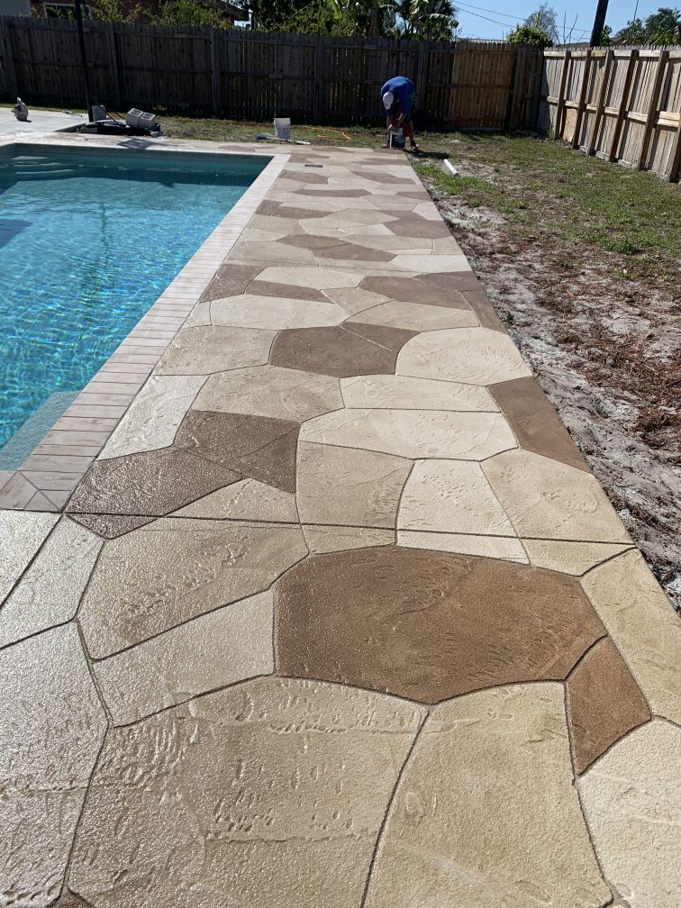 multi-color concrete patio in stone pattern overlay