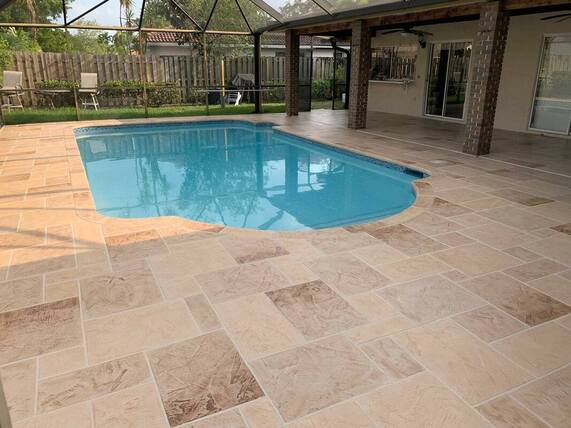 concrete pool deck completed in modern geometric tile stamped concrete pattern